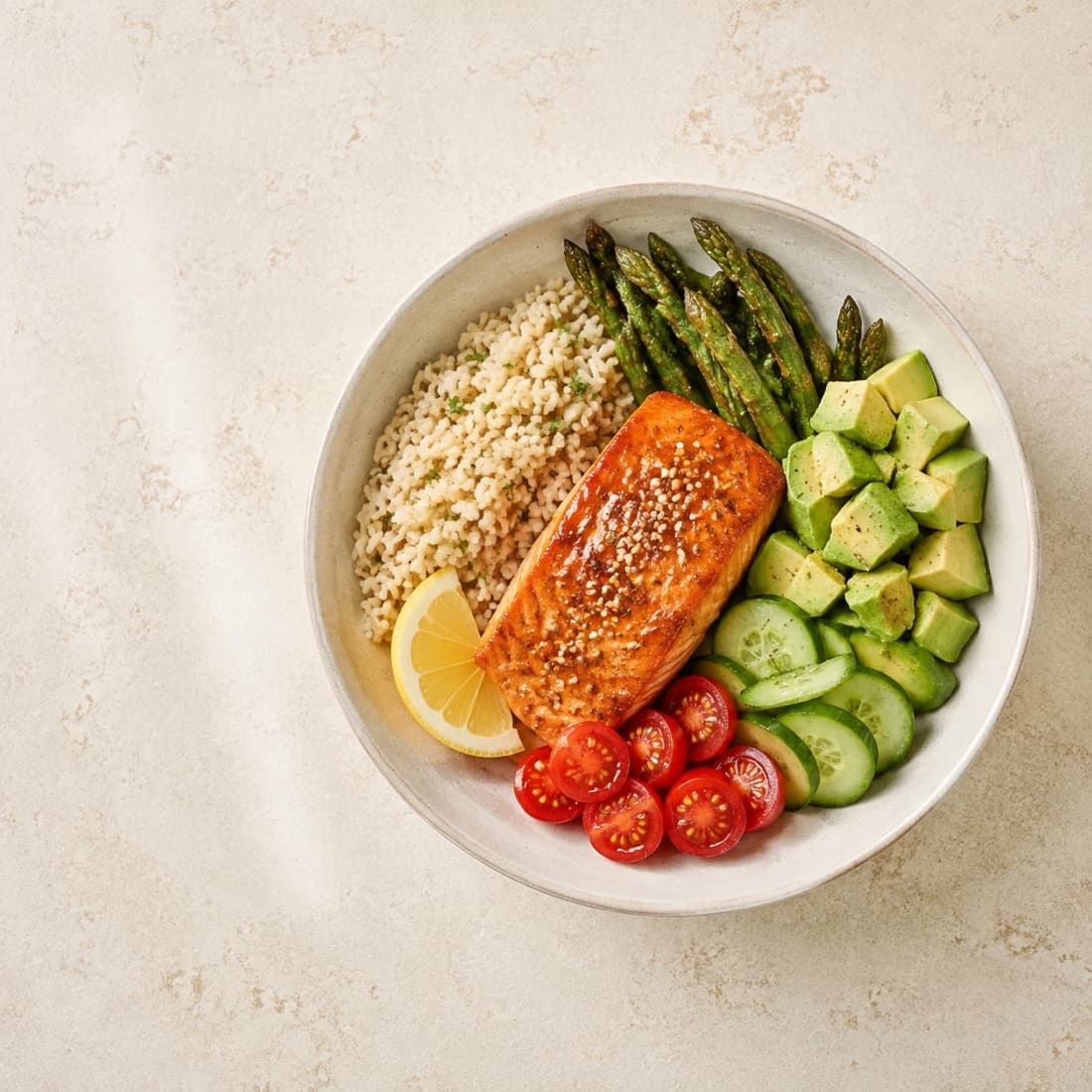 Salmon grain bowl with avocado and fresh vegetables